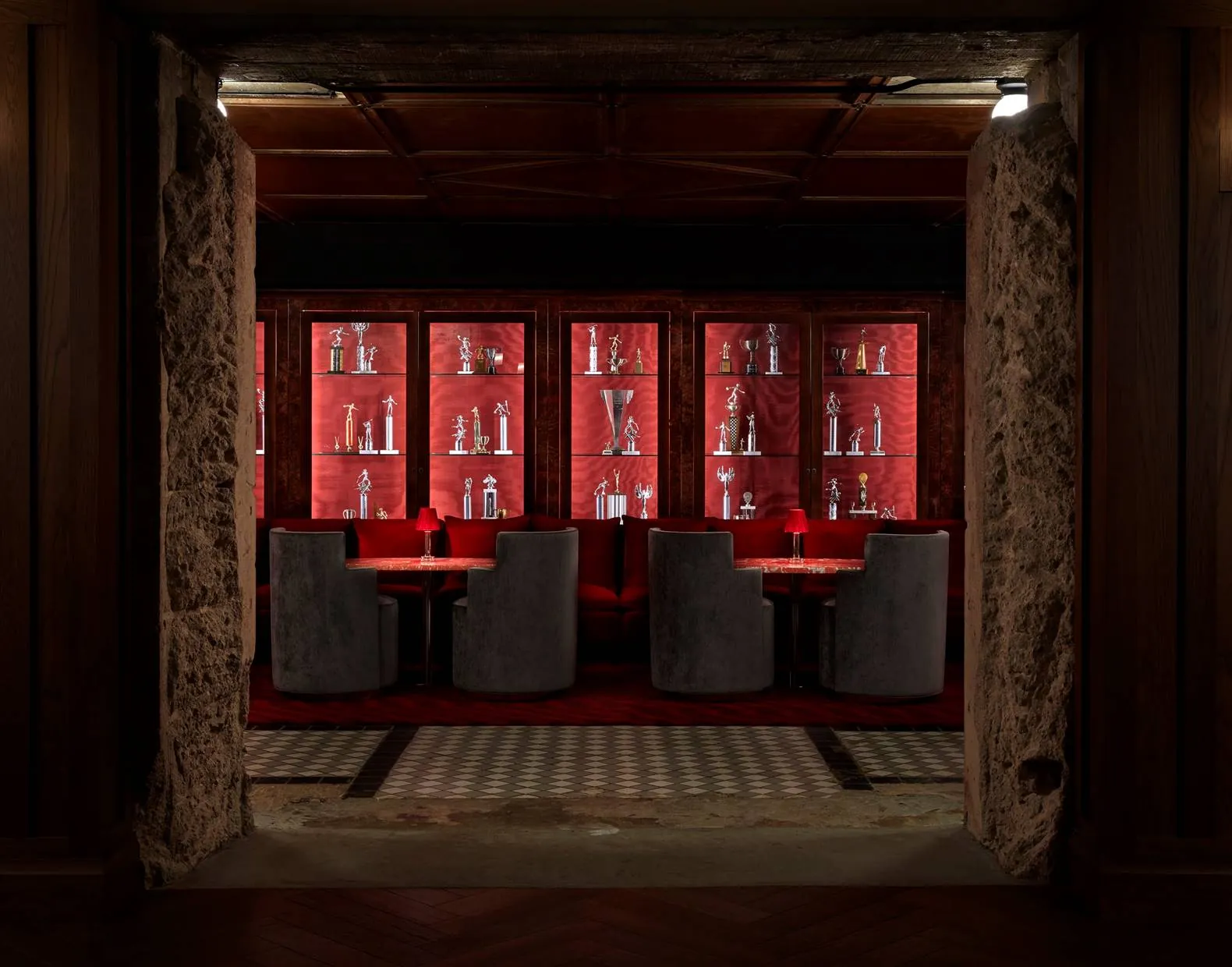 The former bank vault at Silver Lyan, lined with red-lit trophy cabinets